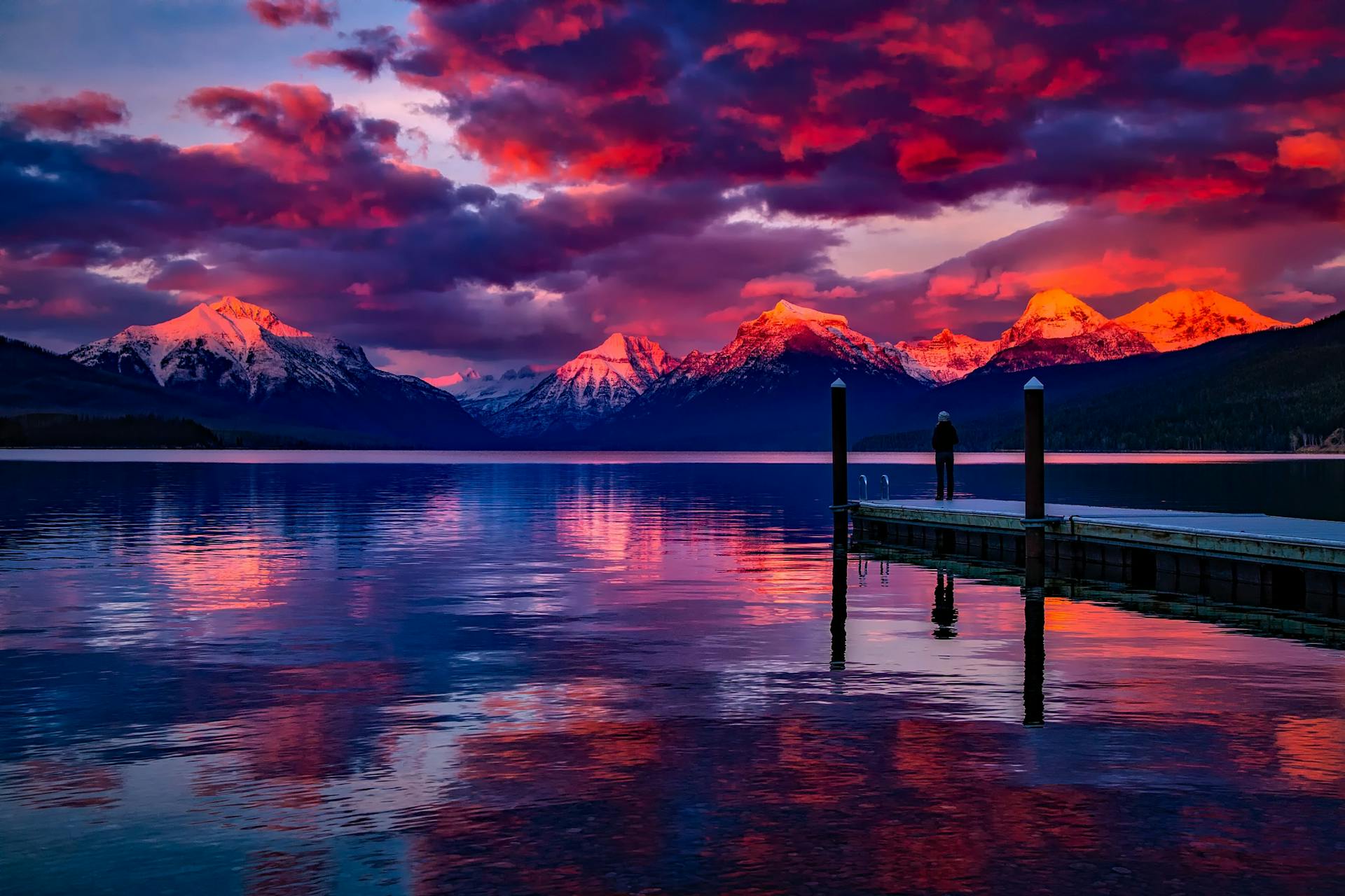 Stunning sunset over a mountain lake with dock
